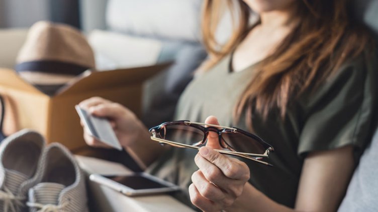 A girl checking the things that ordered via online shopping