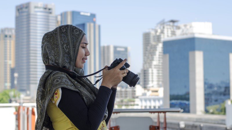 Woman looking at the camera after clicking the picture