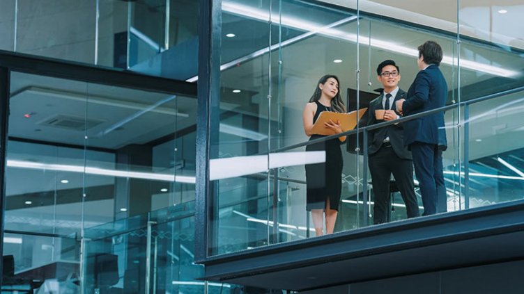 Employees chatting at balcony