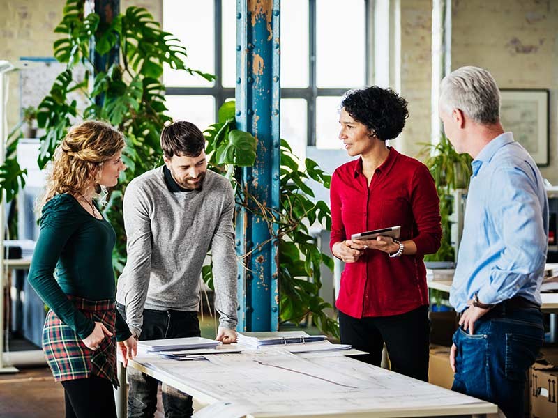 Group of professionals together and discussing