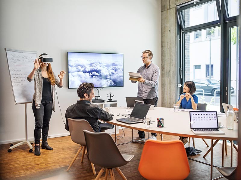 Businesswoman wearing VR headset