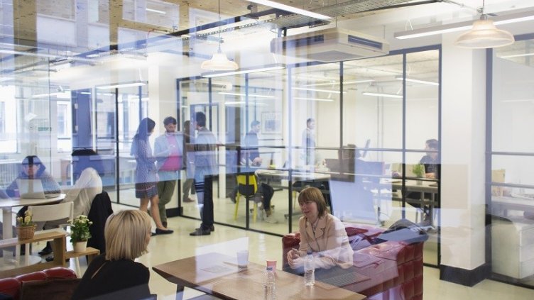 employee sitting in different areas of flexible work space