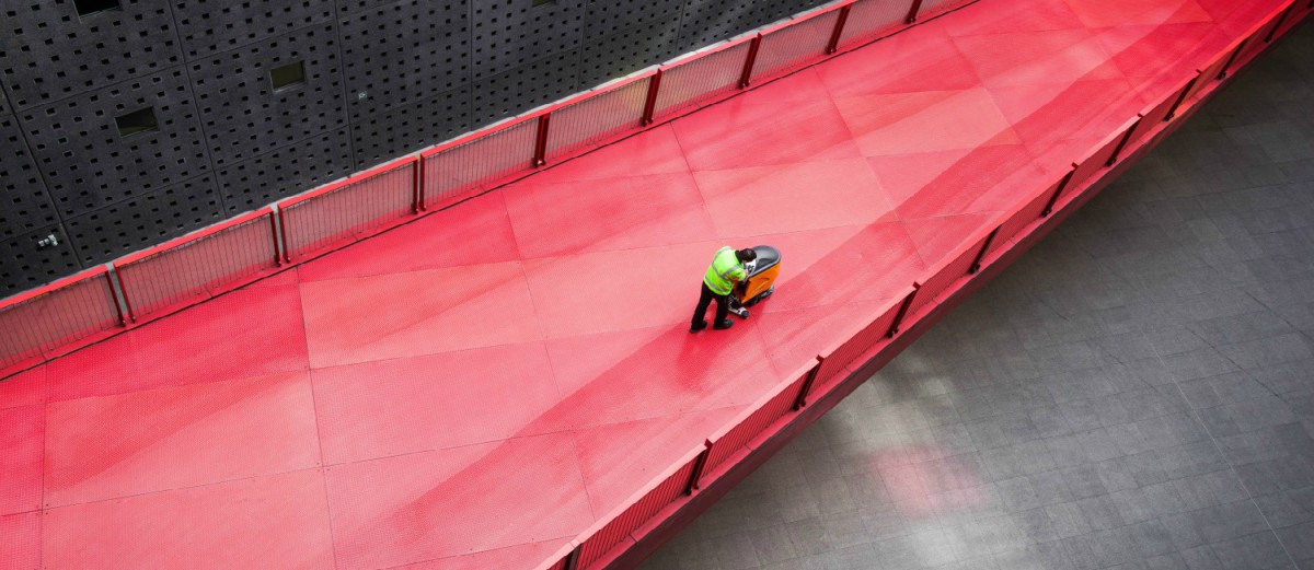 man cleaning red bridge