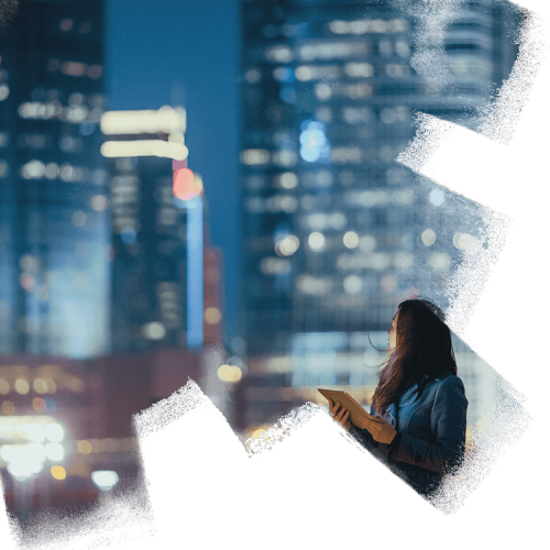 woman on tablet looking at the city