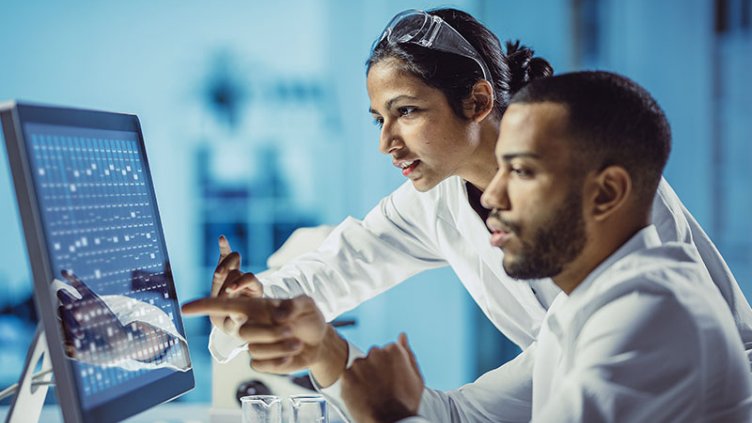 Two people working in lab.